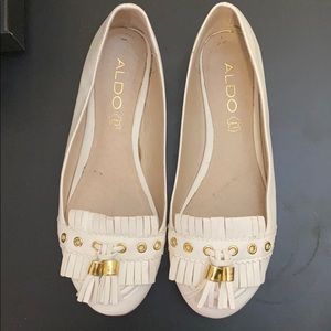 White and gold loafers